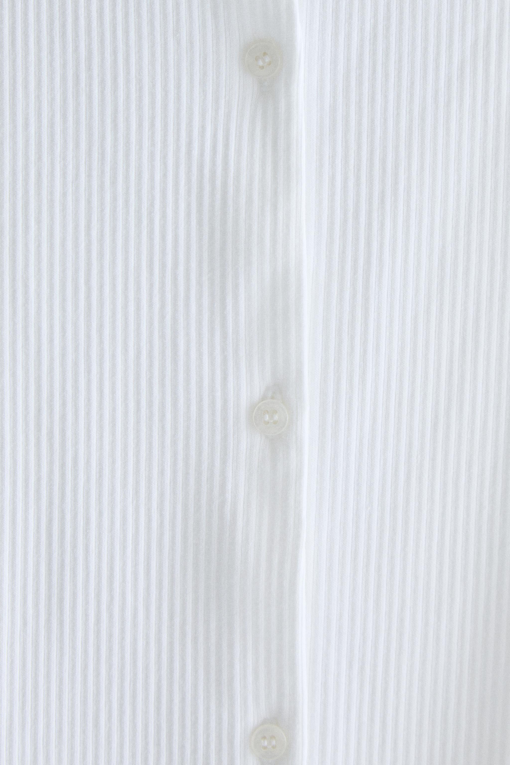 LONG SLEEVE BUTTON T-SHIRT